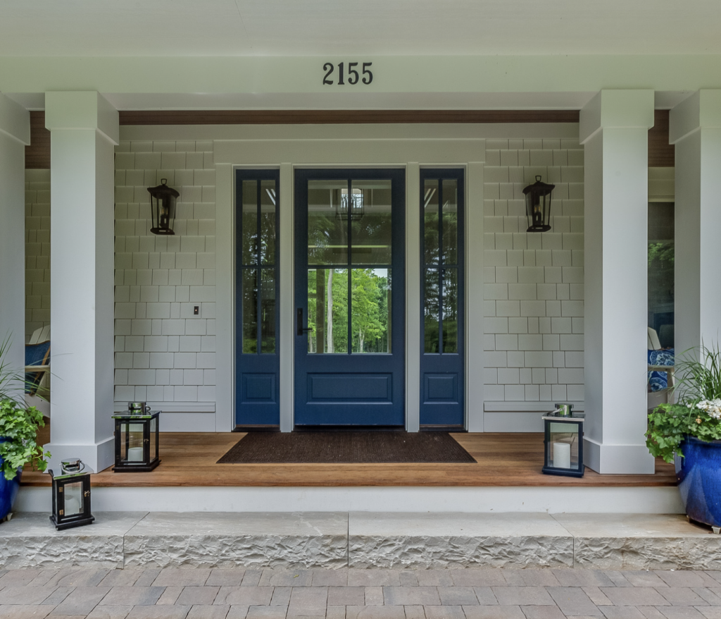 house with blue front door and whtie siding